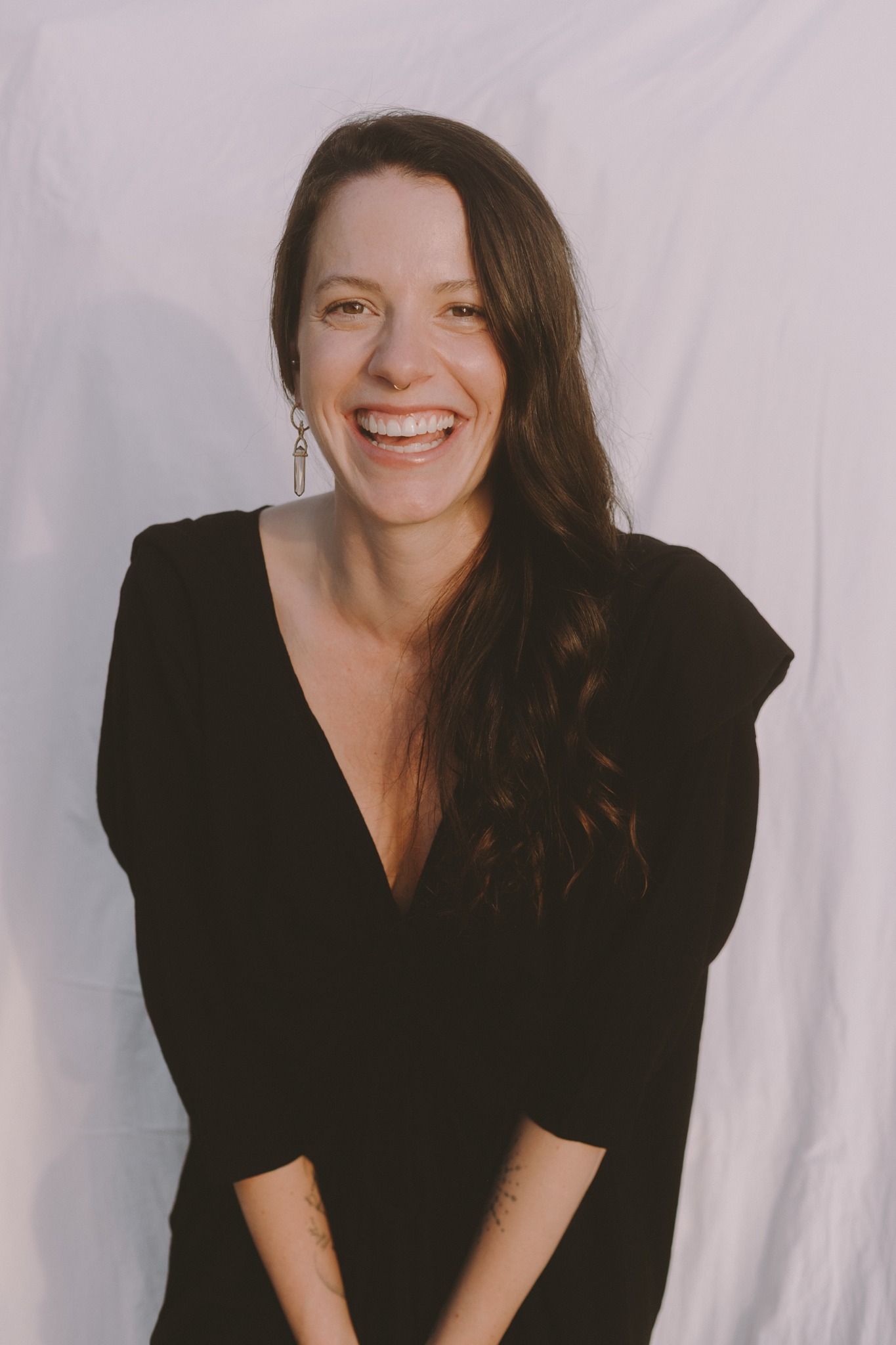 Anna Caldwell smiling in a black dress